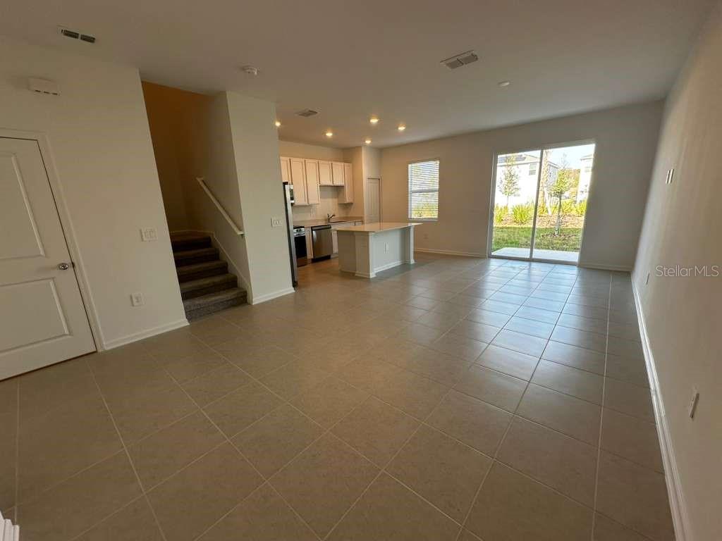 2729 Skyline Loop Kissimmee, FL 34758 - Photo 7 of 20 a view of a kitchen with furniture and a window