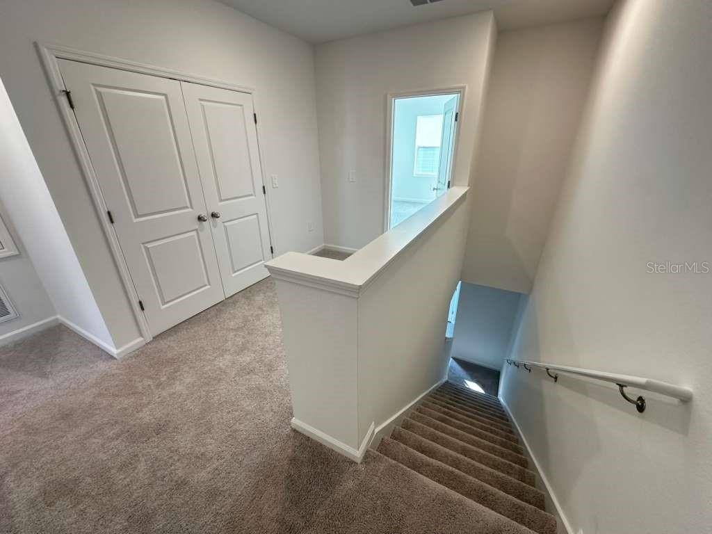 2729 Skyline Loop Kissimmee, FL 34758 - Photo 9 of 20 a view of an entryway with staircase