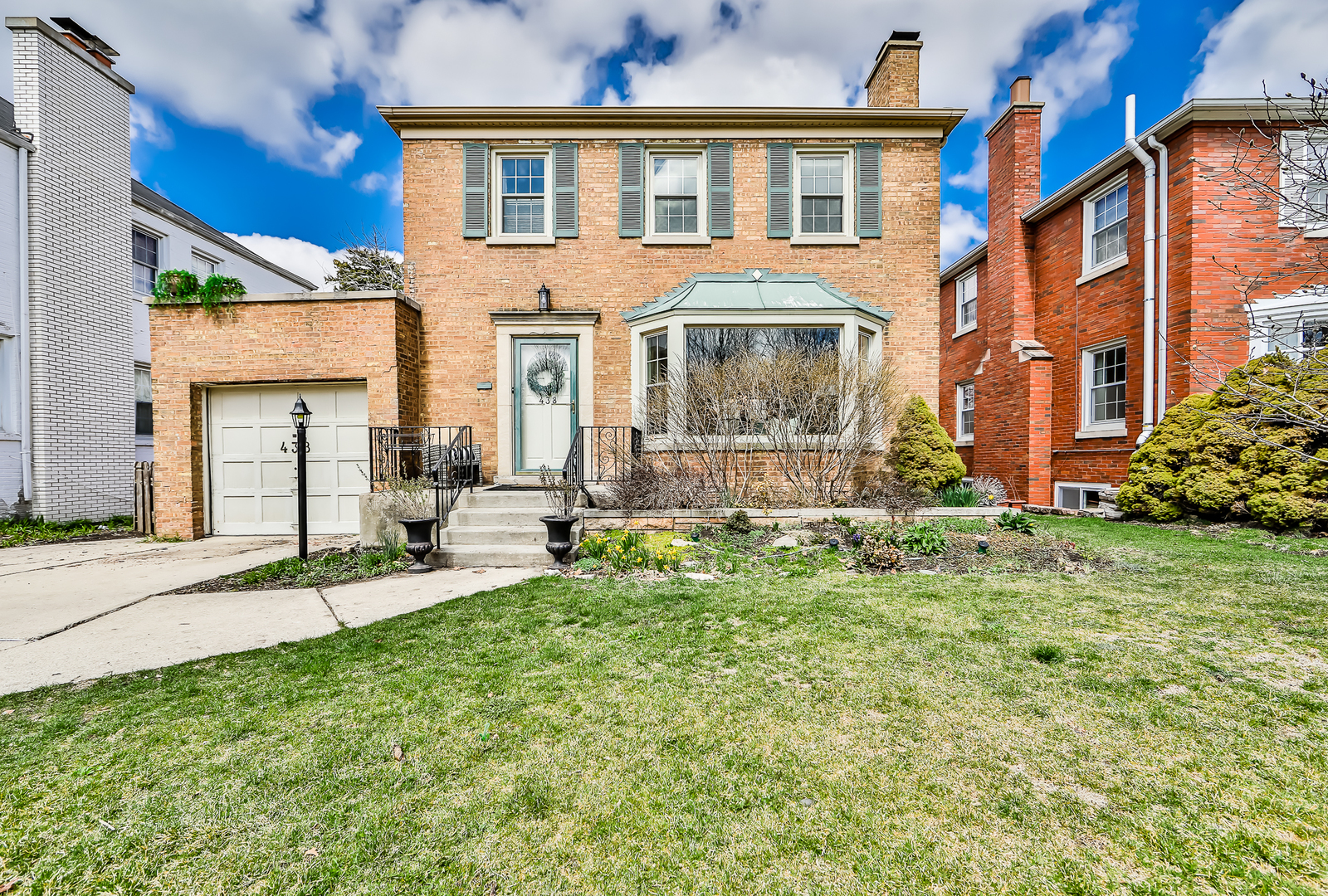 438 Longcommon Road Riverside, IL 60546 - Photo 1 of 16 a front view of a house with a yard