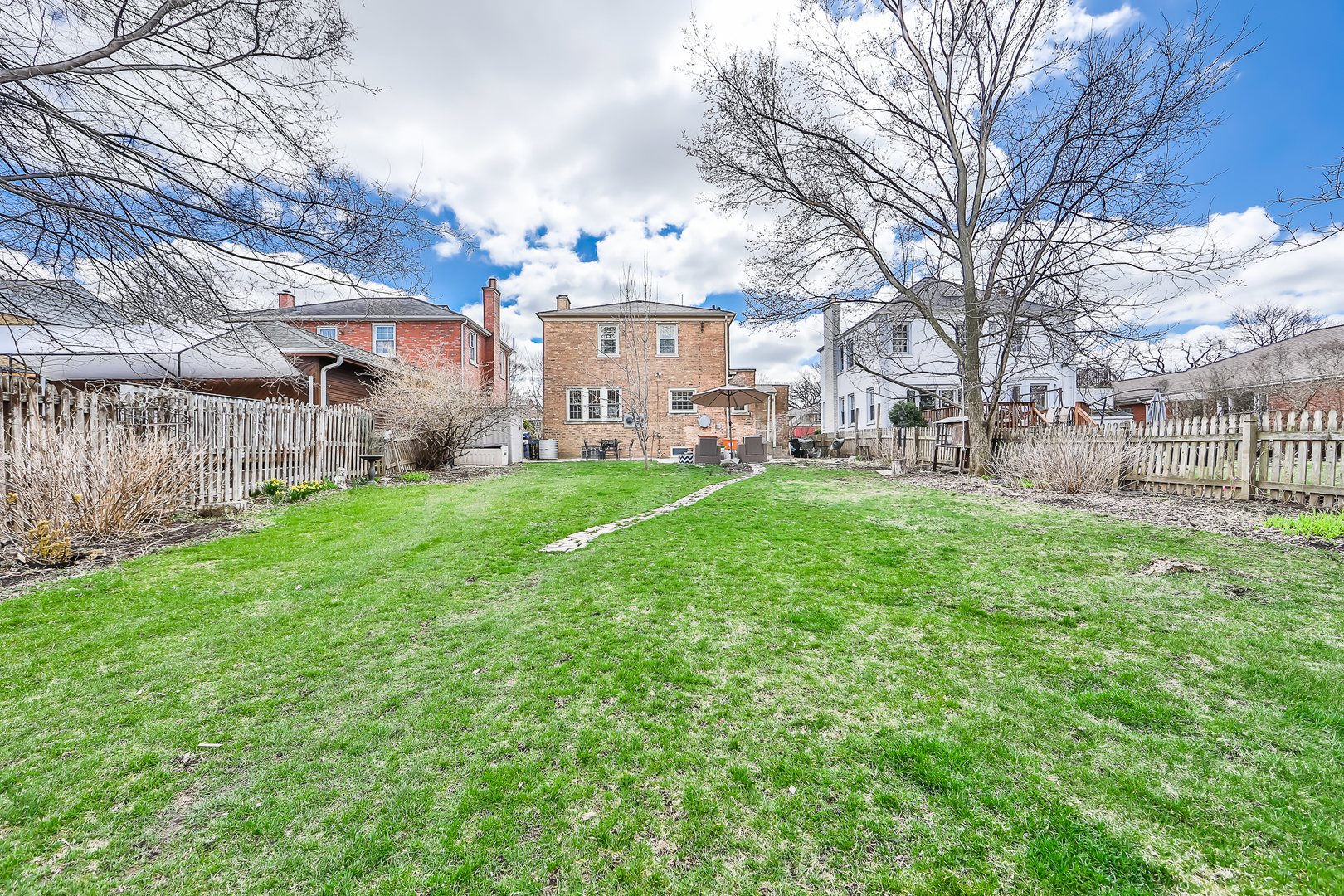 438 Longcommon Road Riverside, IL 60546 - Photo 15 of 16 a view of a house with a yard and sitting area