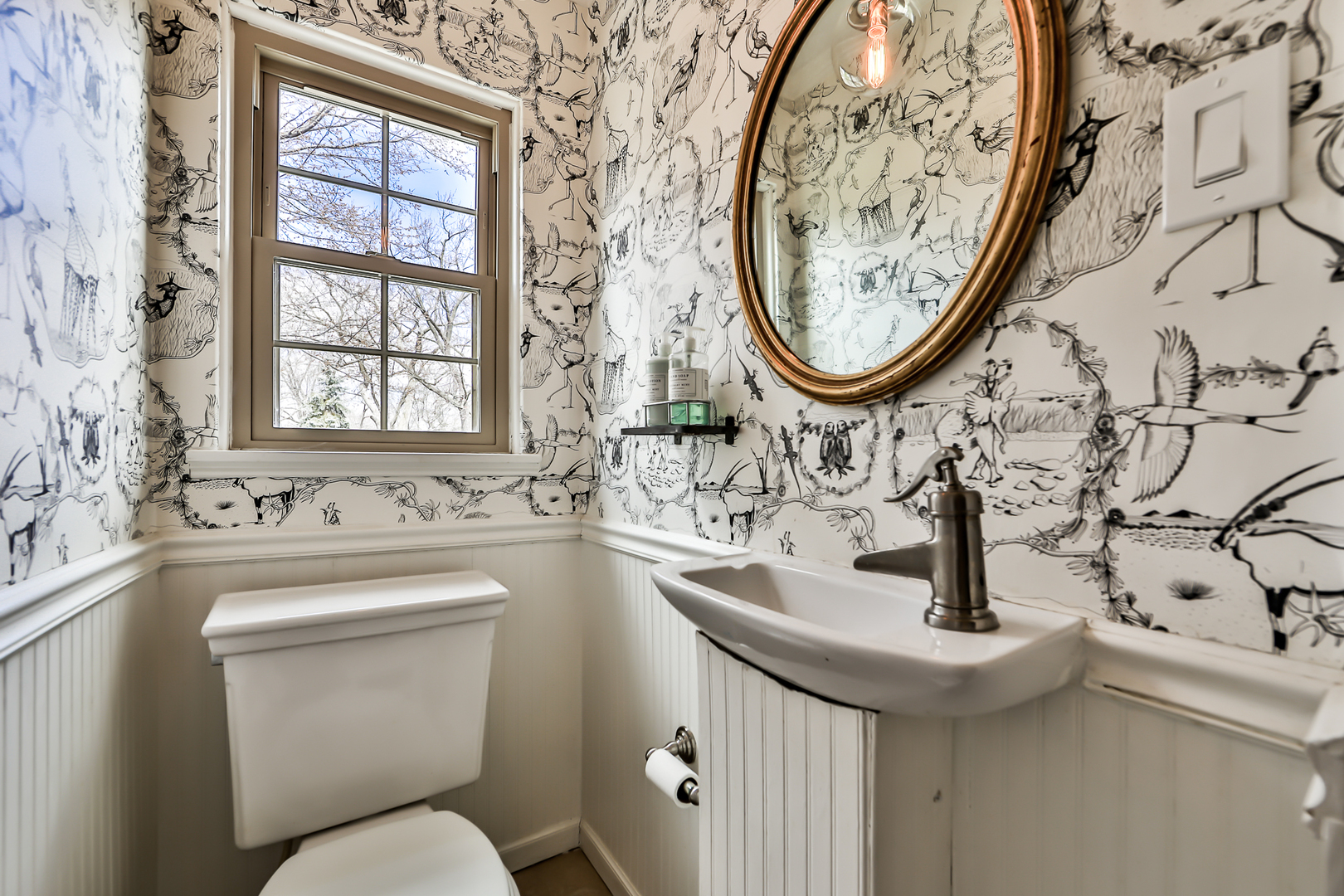 438 Longcommon Road Riverside, IL 60546 - Photo 7 of 16 a bathroom with a sink and a mirror