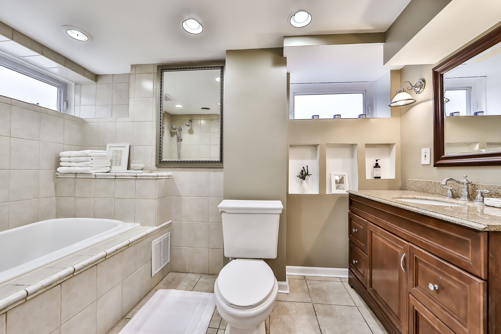 438 Longcommon Road Riverside, IL 60546 - Photo 9 of 16 a bathroom with a sink a toilet and mirror