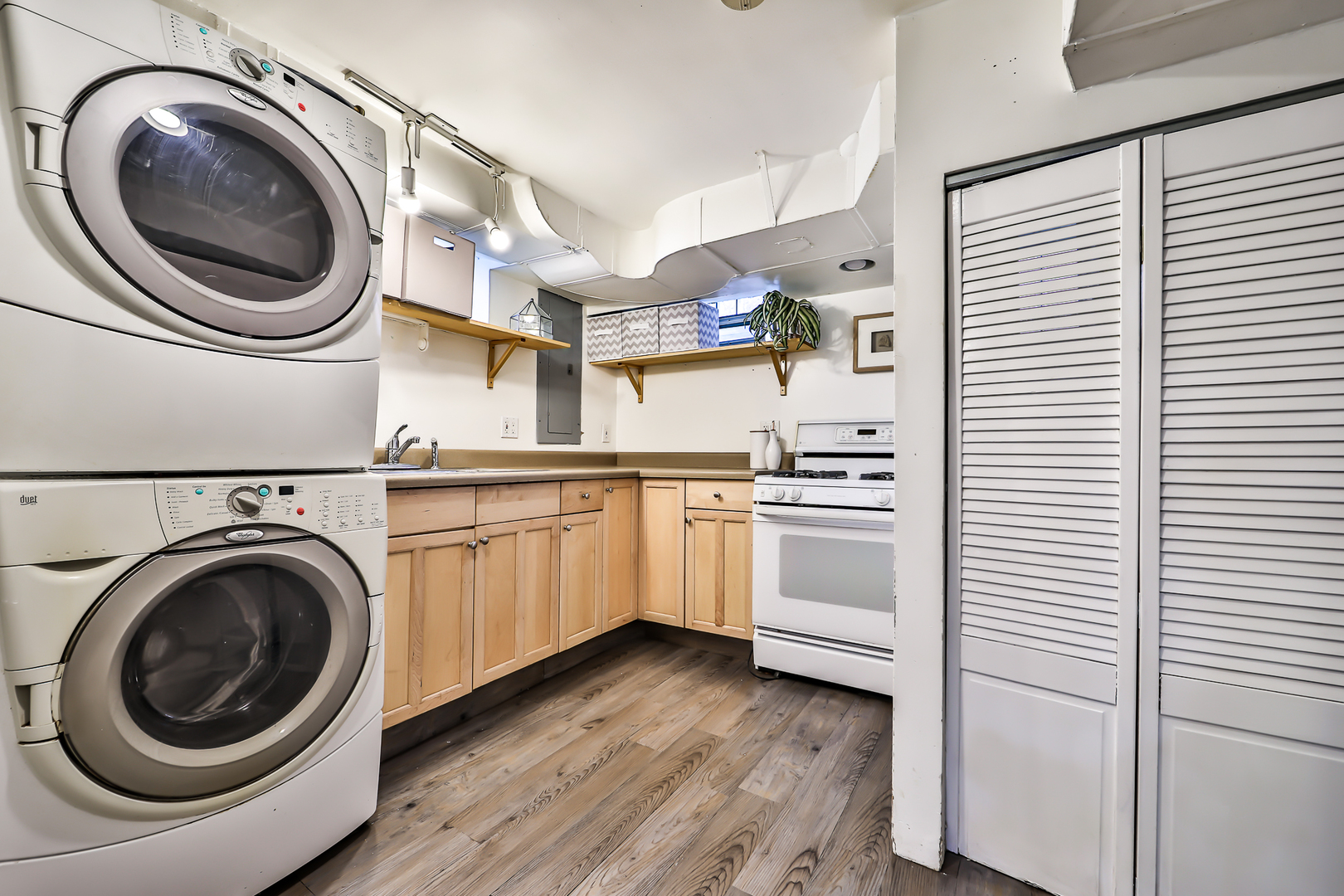 438 Longcommon Road Riverside, IL 60546 - Photo 10 of 16 a kitchen with cabinets and stainless steel appliances