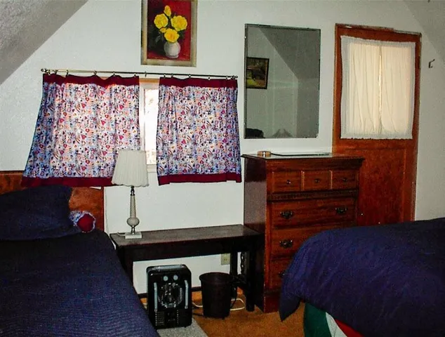 a room with furniture and wooden floor