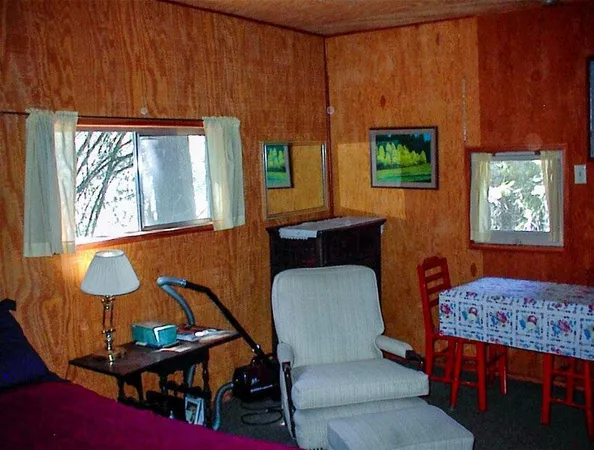 a dining room with furniture and a window