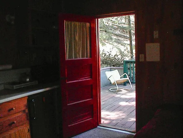 a living room with furniture a bed and a window