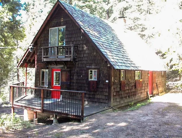 a front view of a house with iron fence