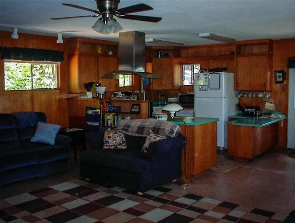 a living room with furniture a window and a fireplace