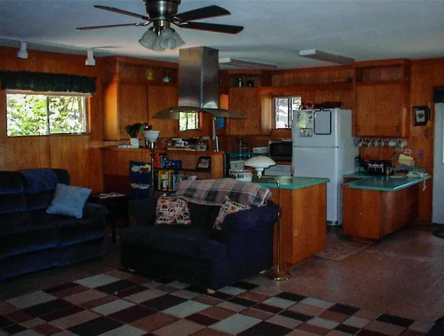 a living room with furniture a window and a fireplace