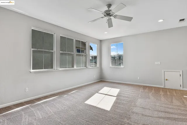 a bedroom with a bed and a tv