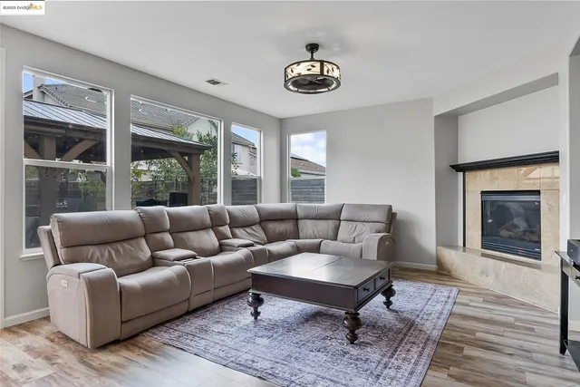 a kitchen with a table chairs refrigerator and cabinets