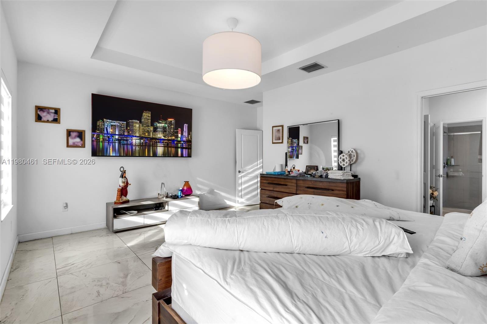 21380 Southwest 127th Place Miami, FL 33177 - Photo 23 of 47 a bedroom with furniture and a flat screen tv