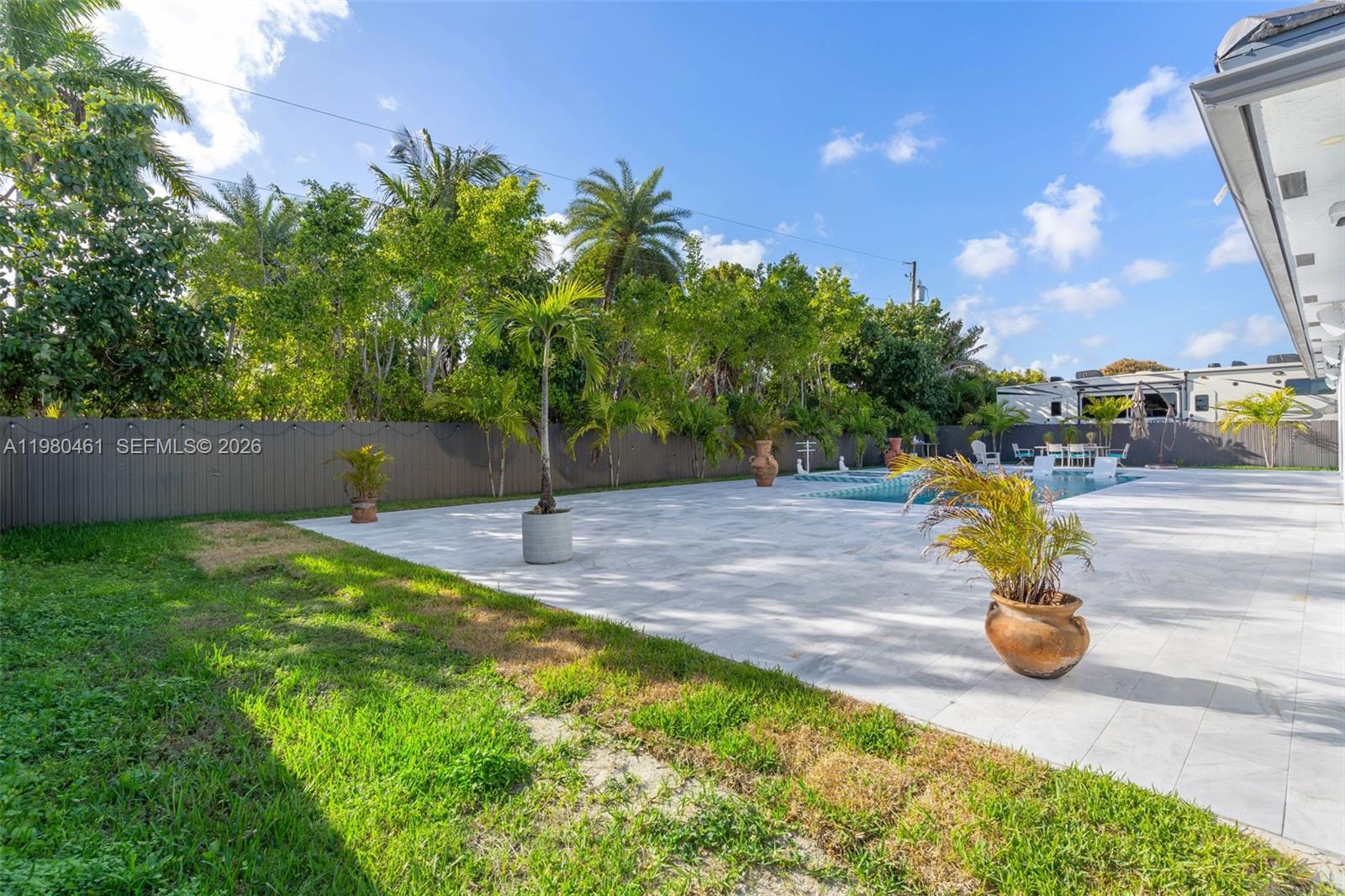 21380 Southwest 127th Place Miami, FL 33177 - Photo 36 of 47 a view of a backyard with swimming pool