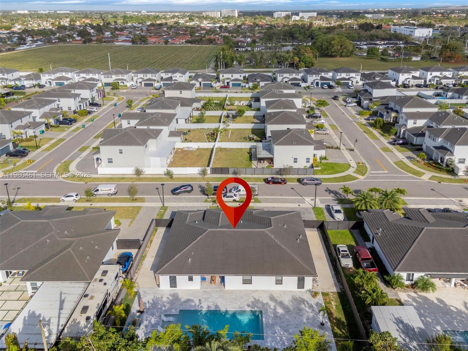 21380 Southwest 127th Place Miami, FL 33177 - Photo 41 of 47 an aerial view of a city with lake view