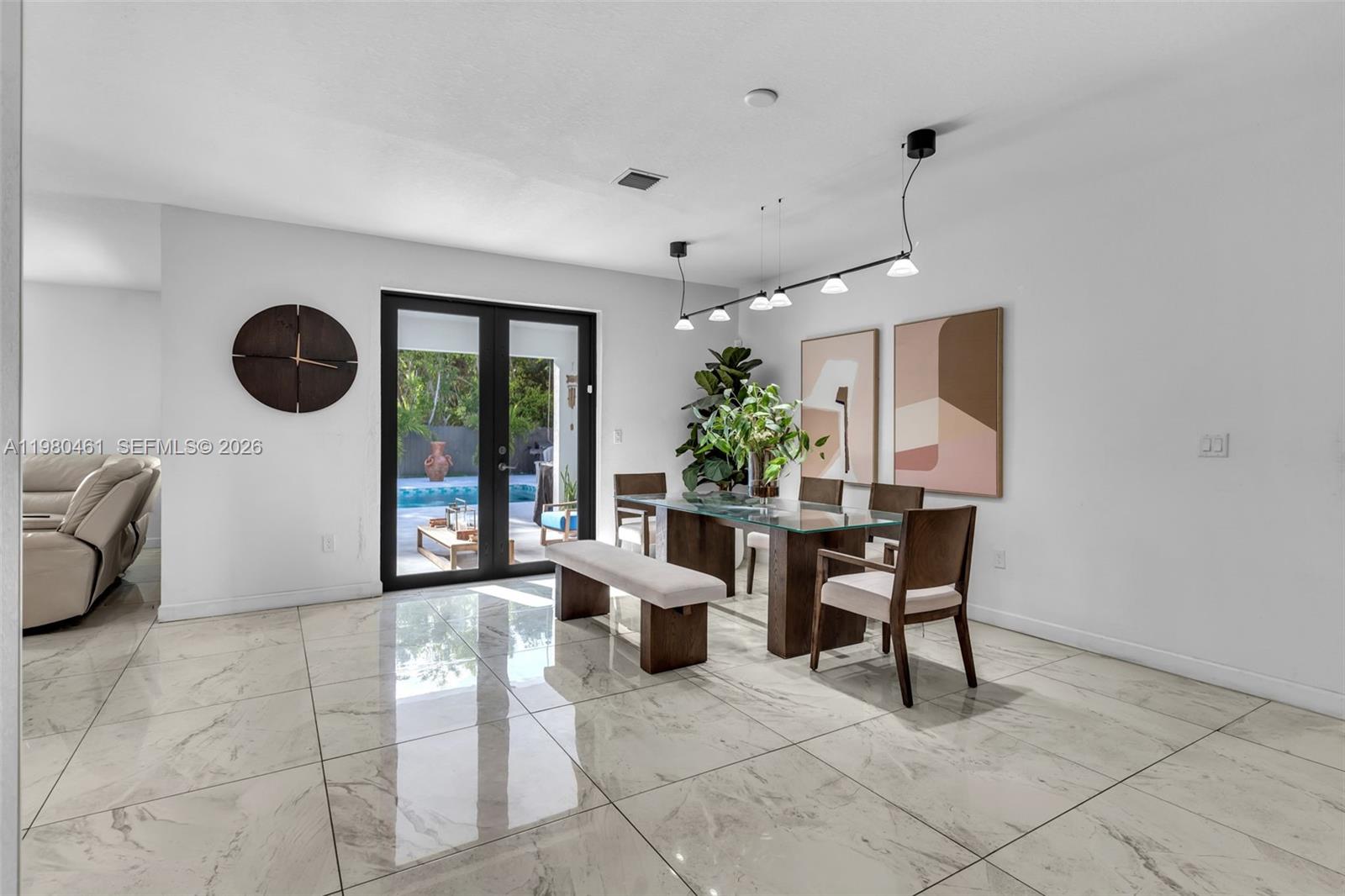 21380 Southwest 127th Place Miami, FL 33177 - Photo 7 of 47 a view of a livingroom with furniture and window