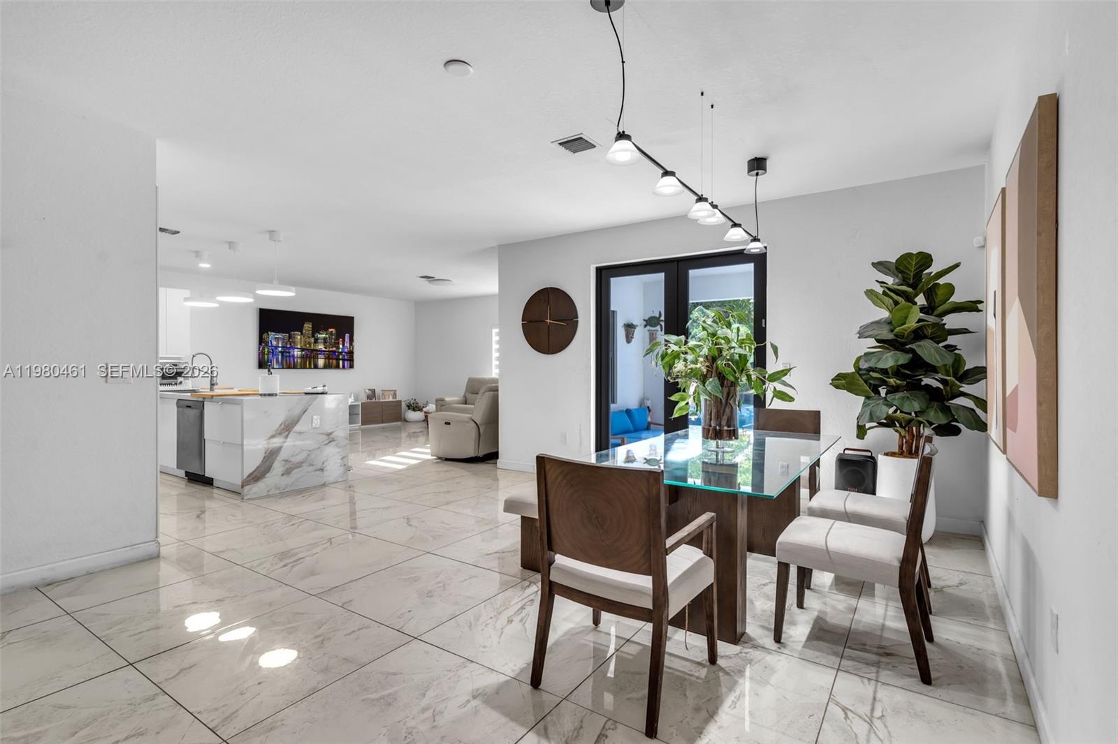 21380 Southwest 127th Place Miami, FL 33177 - Photo 8 of 47 a dining room with furniture and a large window