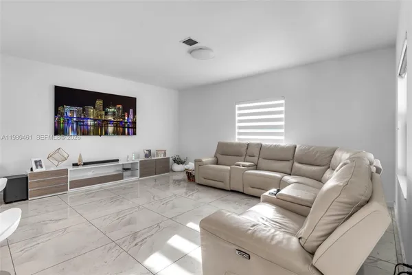 a living room with furniture and a window