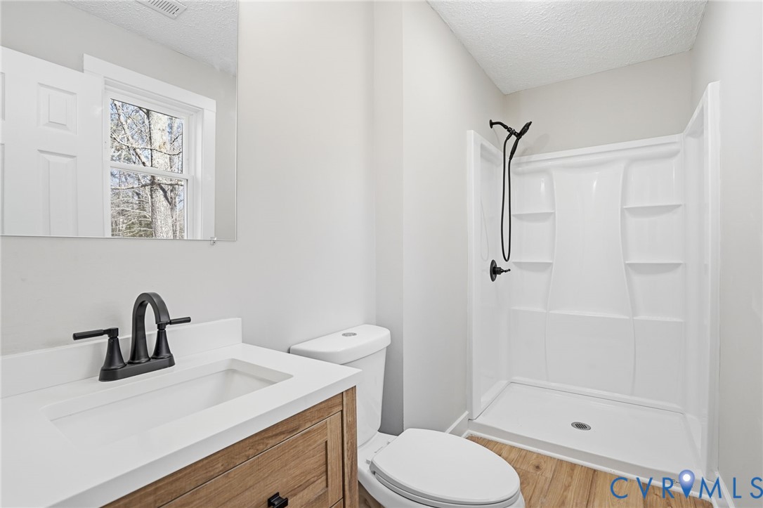 286 Mill Pond Road South St. Stephens Church, VA 23148 - Photo 24 of 39 a bathroom with a sink toilet and shower