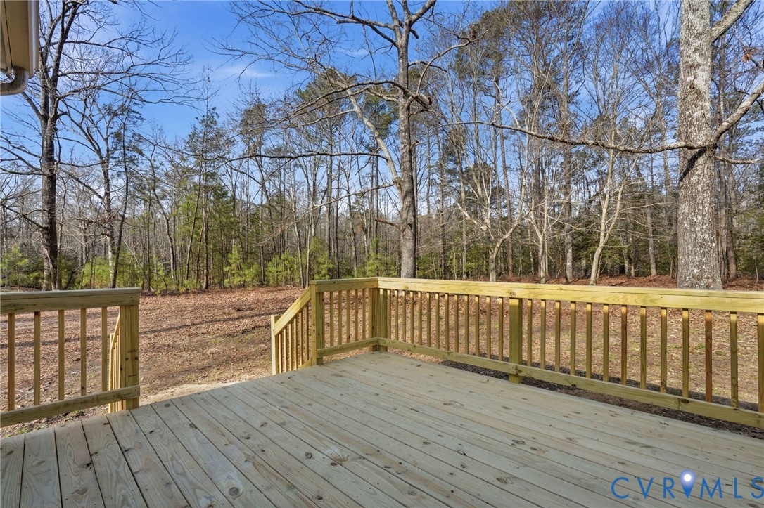286 Mill Pond Road South St. Stephens Church, VA 23148 - Photo 27 of 39 a view of balcony with wooden floor and fence