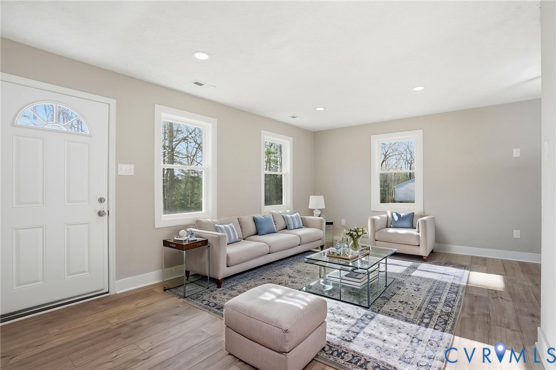 286 Mill Pond Road South St. Stephens Church, VA 23148 - Photo 3 of 39 a living room with furniture and wooden floor