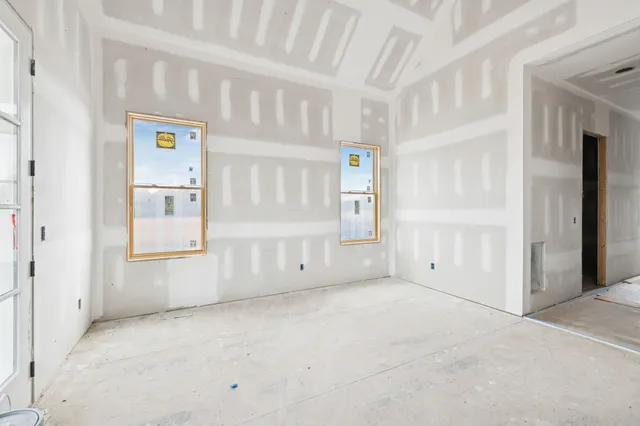 a black and white photo of a living room