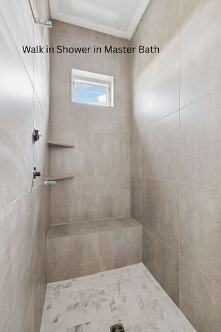 a view of a house with a wooden deck