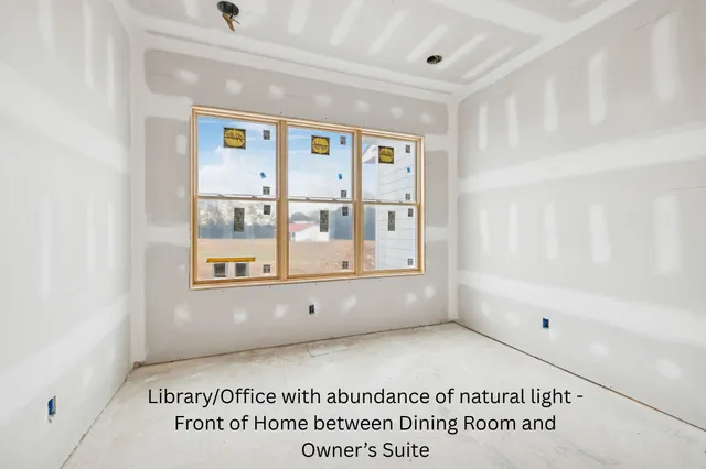 a view of a white house with a yard