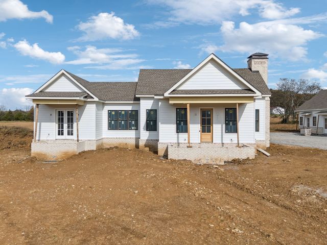 a front view of a house with yard