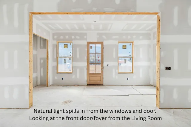 an aerial view of a house with outdoor space and lake view