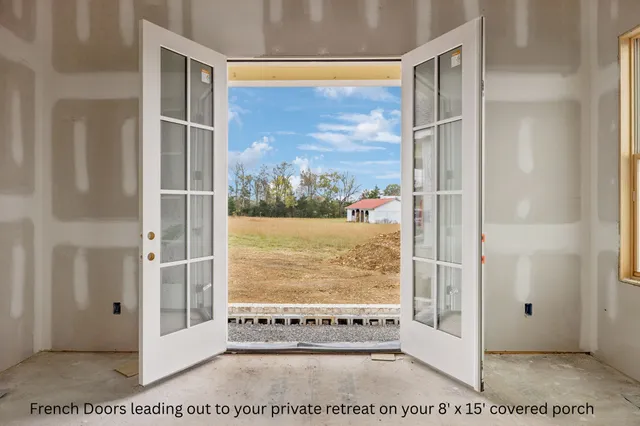 a view of a lake with houses in the back