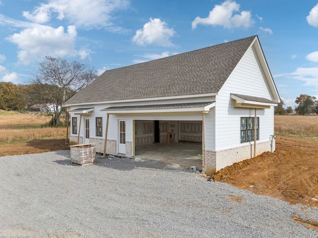 a view of a house with sitting area and roof