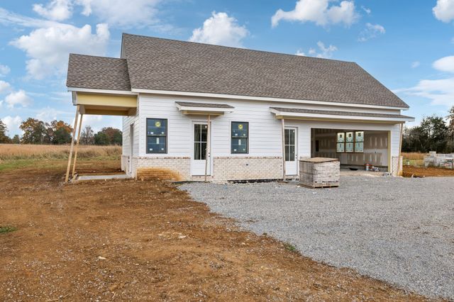 a front view of a house with basket ball court and porch