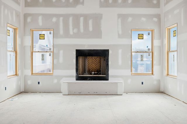 a large white bed sitting in a spacious bedroom