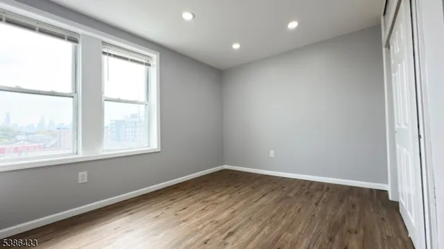a bathroom with a bathtub a sink and a window