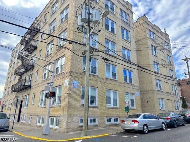 a kitchen with stainless steel appliances a stove a sink a microwave and refrigerator