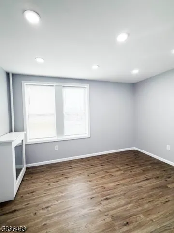 a view of a livingroom with wooden floor
