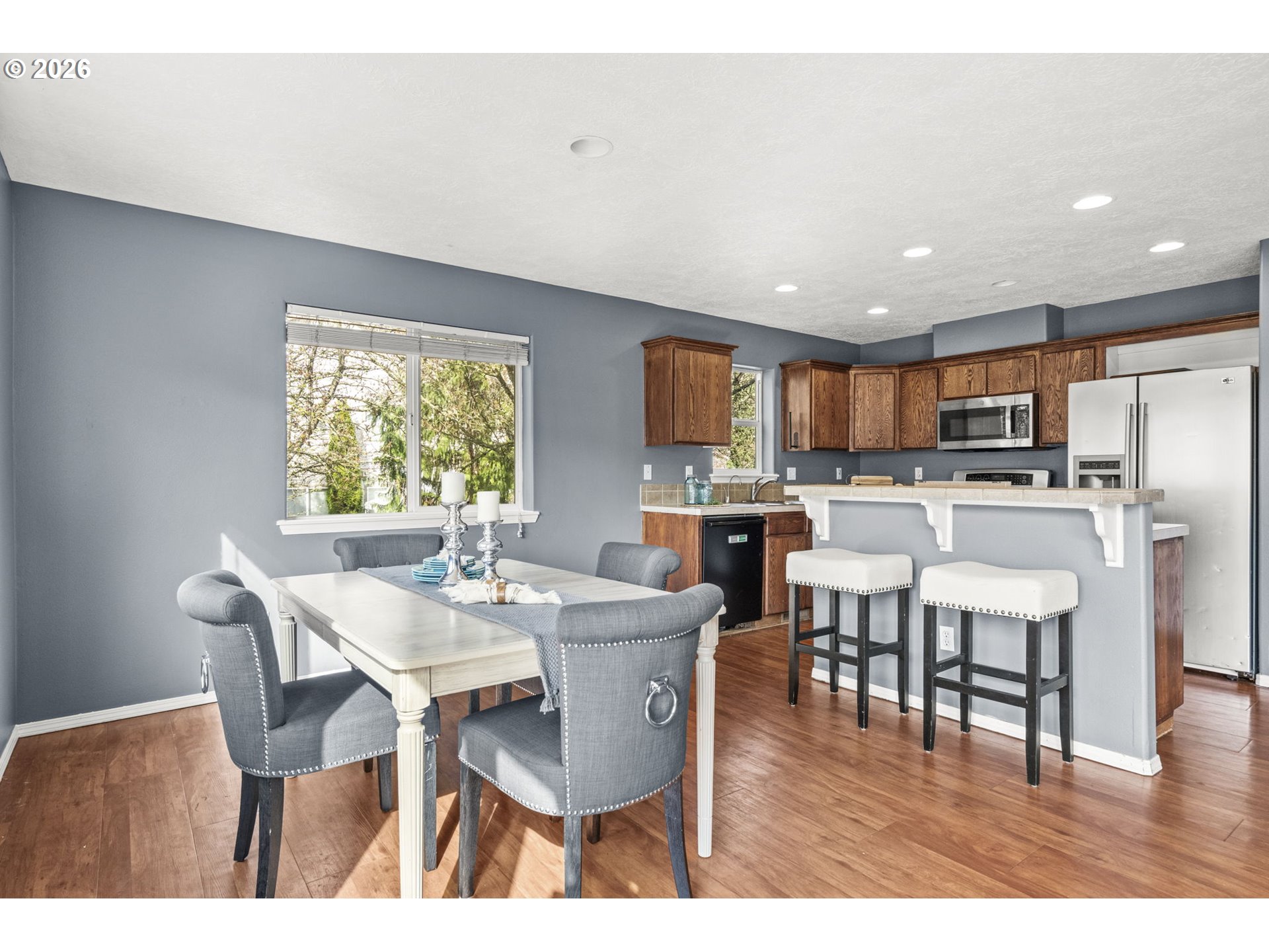 38882 Haskins Street Sandy, OR 97055 - Photo 13 of 46 a view of a dining room with furniture wooden floor and a kitchen view