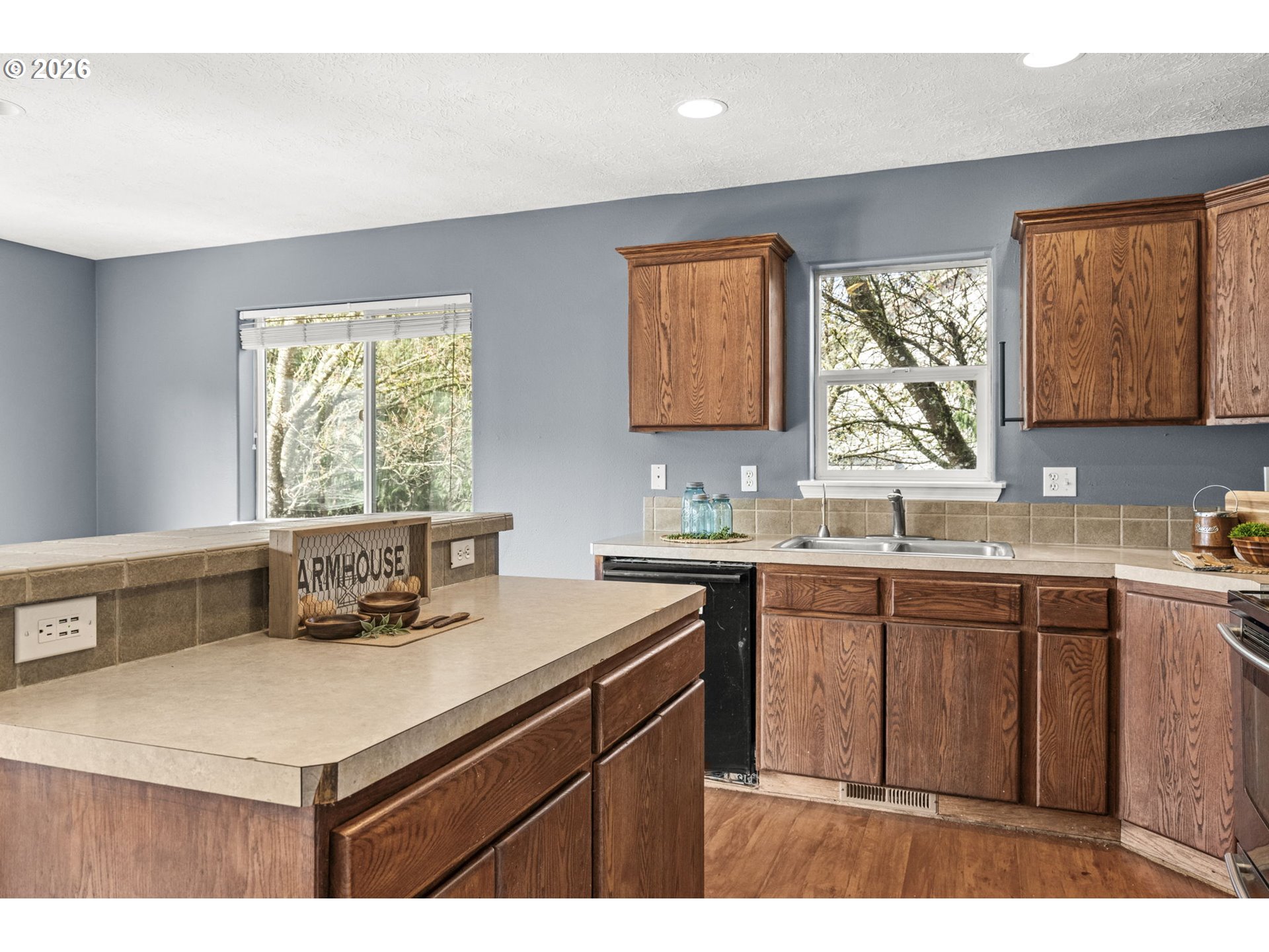 38882 Haskins Street Sandy, OR 97055 - Photo 17 of 46 a kitchen with a sink a window and cabinets