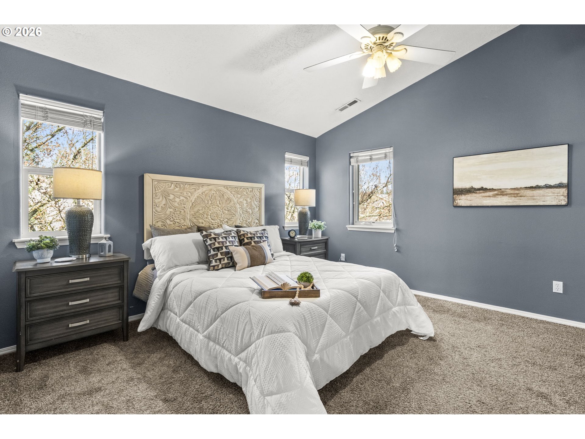 38882 Haskins Street Sandy, OR 97055 - Photo 24 of 46 a bed room with a bed and a chandelier
