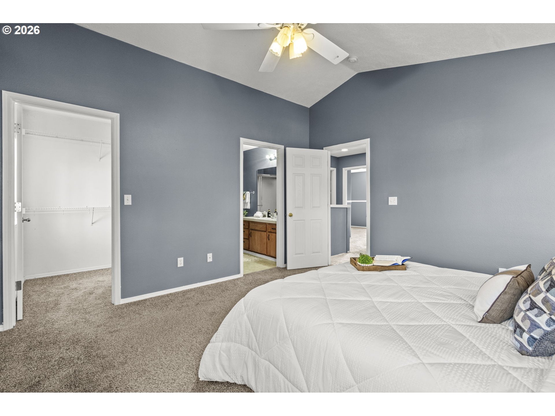 38882 Haskins Street Sandy, OR 97055 - Photo 26 of 46 a bedroom with a bed and a chandelier