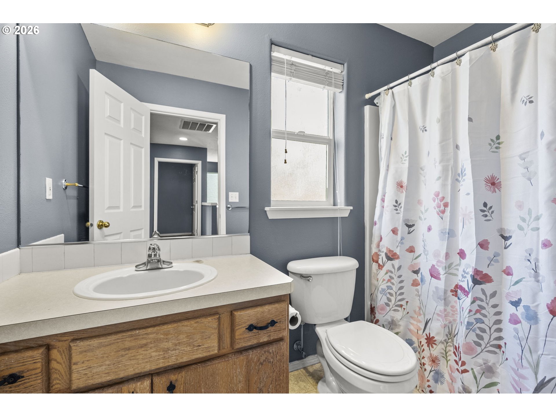 38882 Haskins Street Sandy, OR 97055 - Photo 35 of 46 a bathroom with a sink toilet a mirror and shower