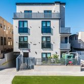 a view of multiple house with a swimming pool
