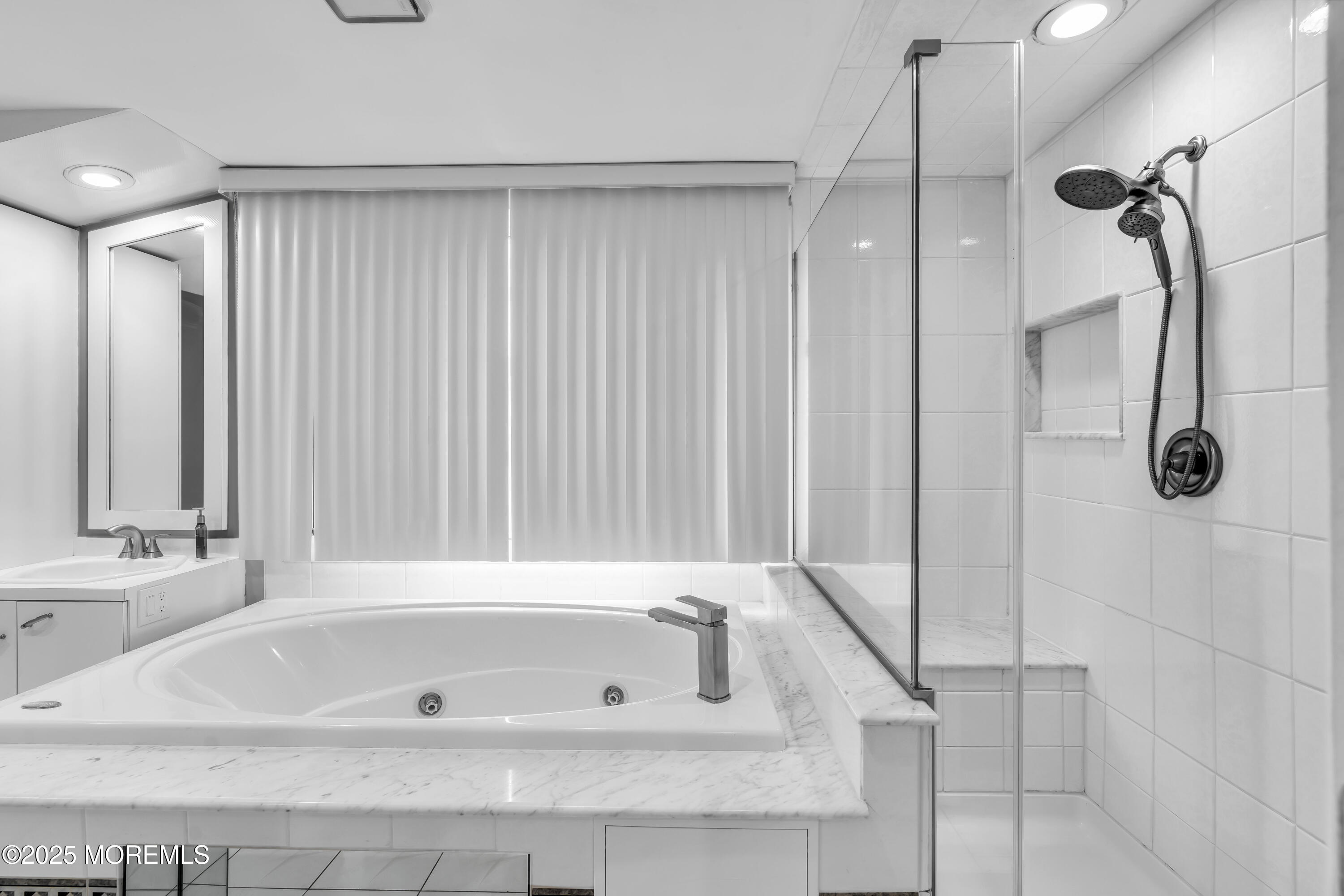 15 Windsor Road Howell, NJ 07731 - Photo 26 of 46 a bathroom with a tub a sink and shower