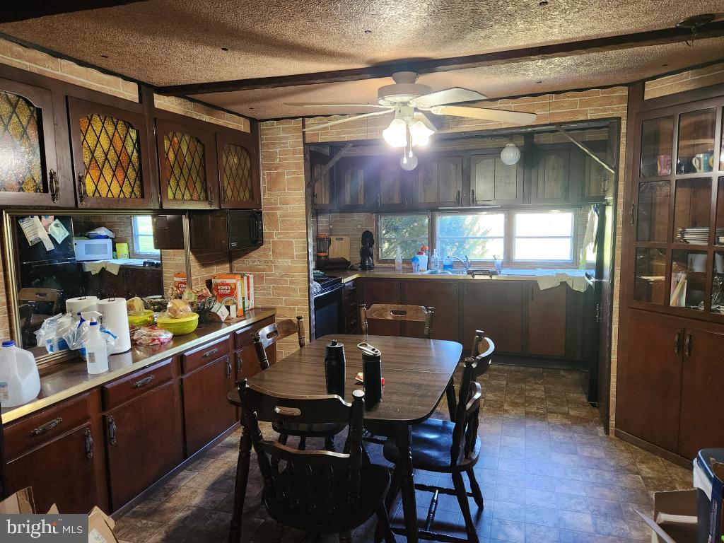 1692 Gish Road Manheim, PA 17545 - Photo 11 of 35 a kitchen with a dining table and chairs
