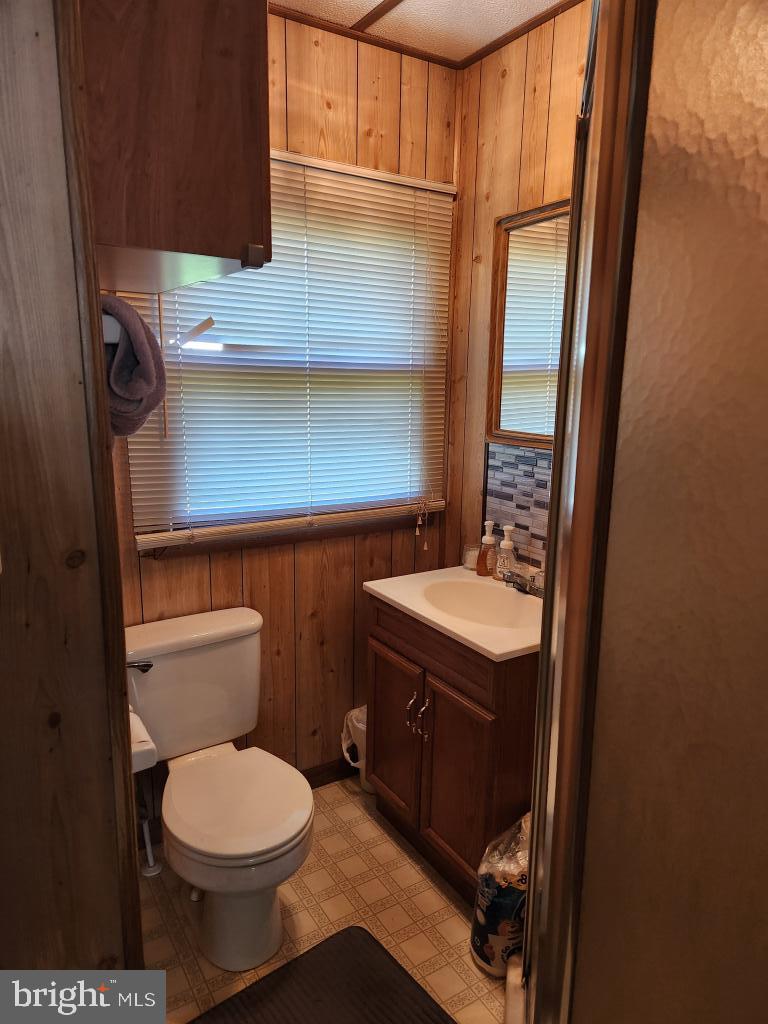 1692 Gish Road Manheim, PA 17545 - Photo 17 of 35 a bathroom with a toilet a sink and a mirror