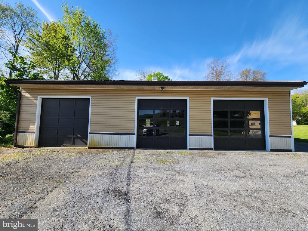 1692 Gish Road Manheim, PA 17545 - Photo 35 of 35 a front view of a house with yard and garage