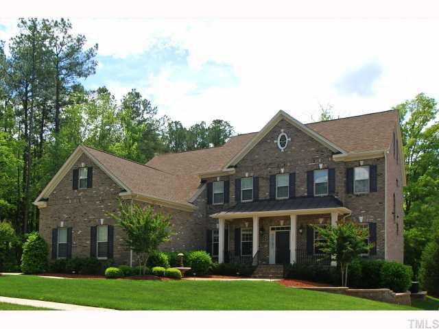3921 Sunridge Road Raleigh, NC 27613 - Photo 1 of 12 a front view of a house with a yard