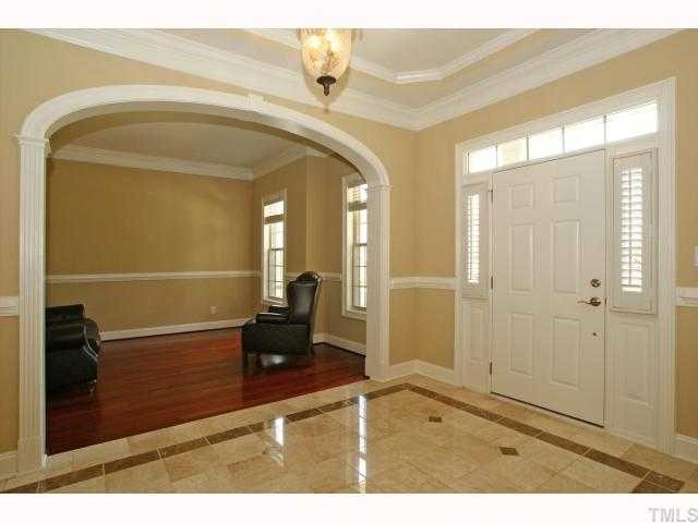 3921 Sunridge Road Raleigh, NC 27613 - Photo 2 of 12 a view of a hallway with a glass door