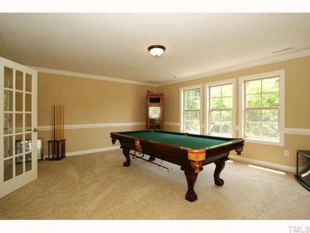 3921 Sunridge Road Raleigh, NC 27613 - Photo 7 of 12 a room with pool table and windows