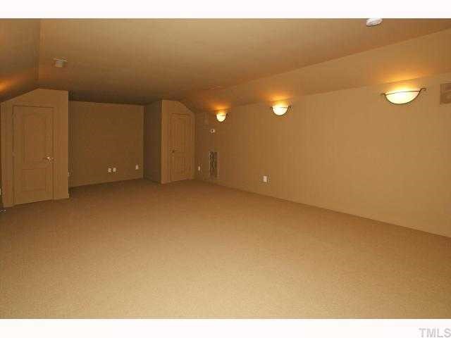 3921 Sunridge Road Raleigh, NC 27613 - Photo 10 of 12 a view of an empty room